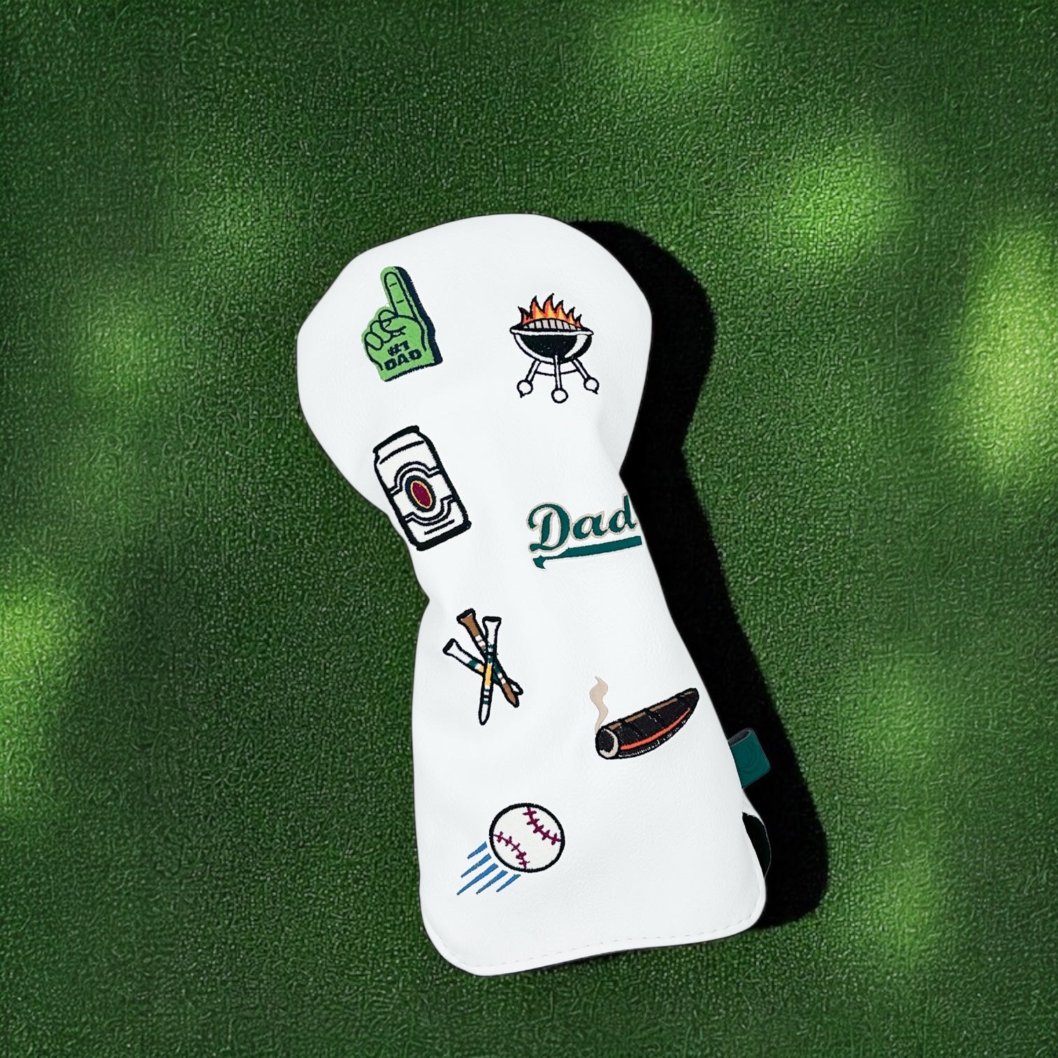 Father's Day-themed golf club driver head cover with custom patches on green turf