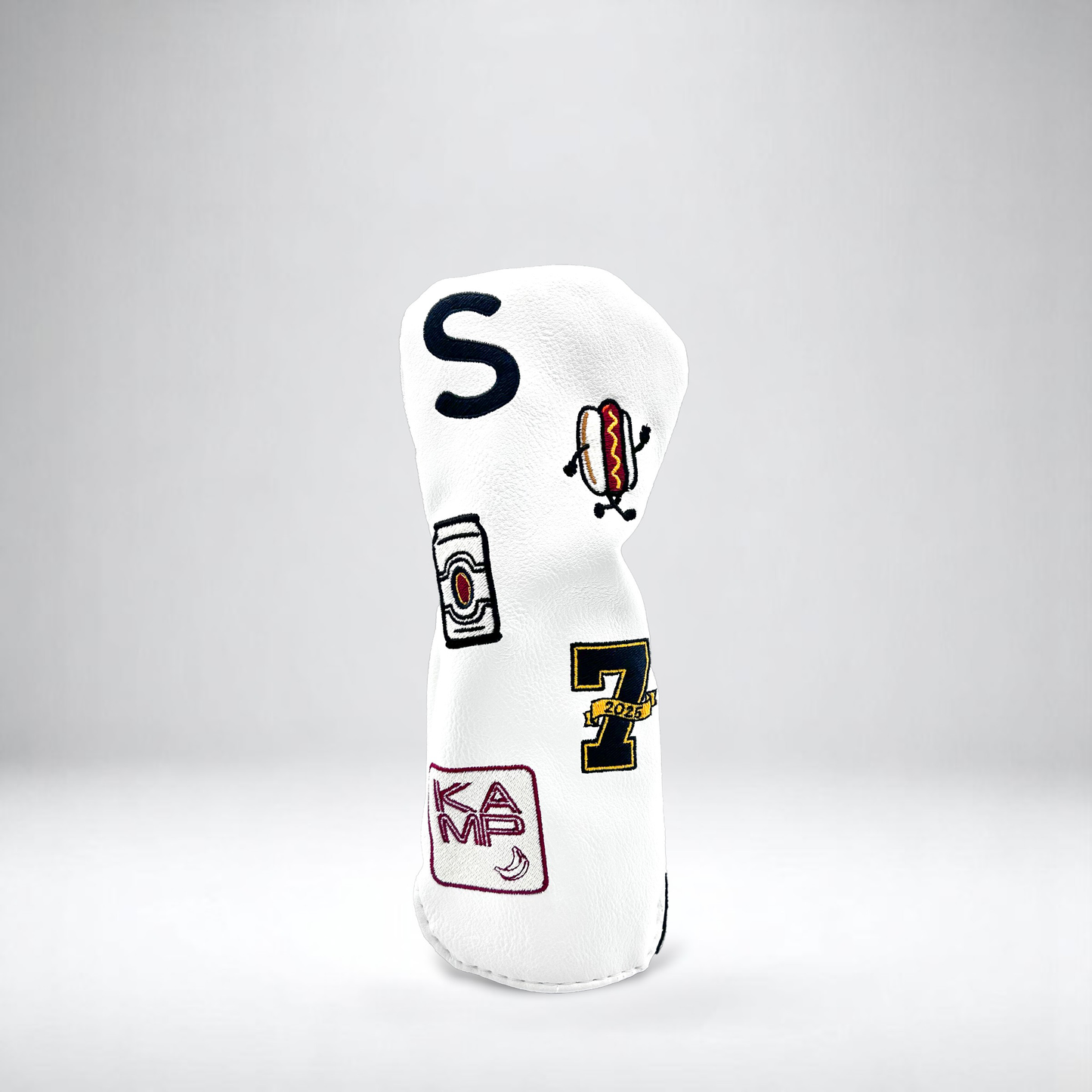 White golf club hybrid head cover with custom patches on white backdrop
