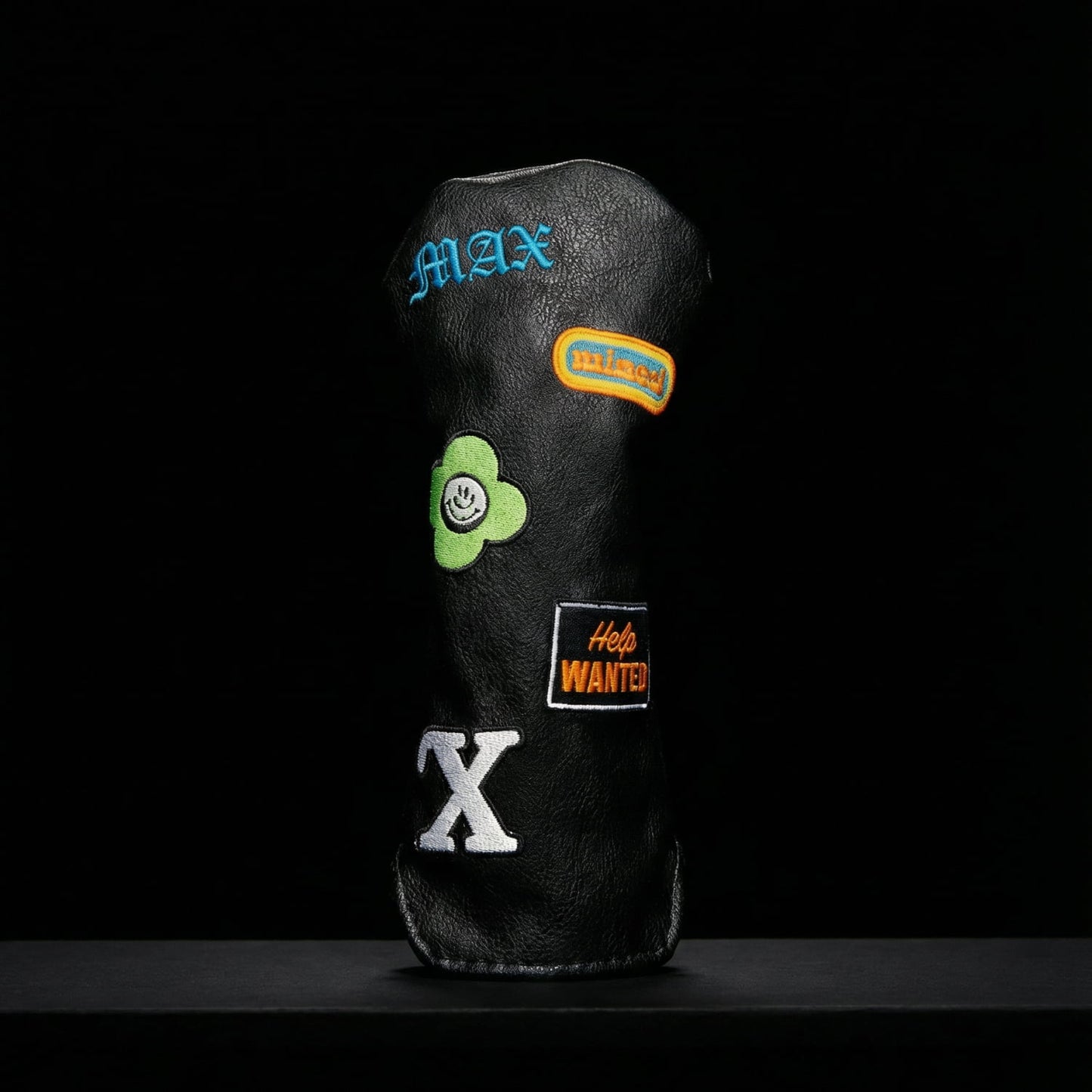 Custom black hybrid golf club cover with MAX monogram, Miami patch, green flower, and Help Wanted patches - premium vegan leather