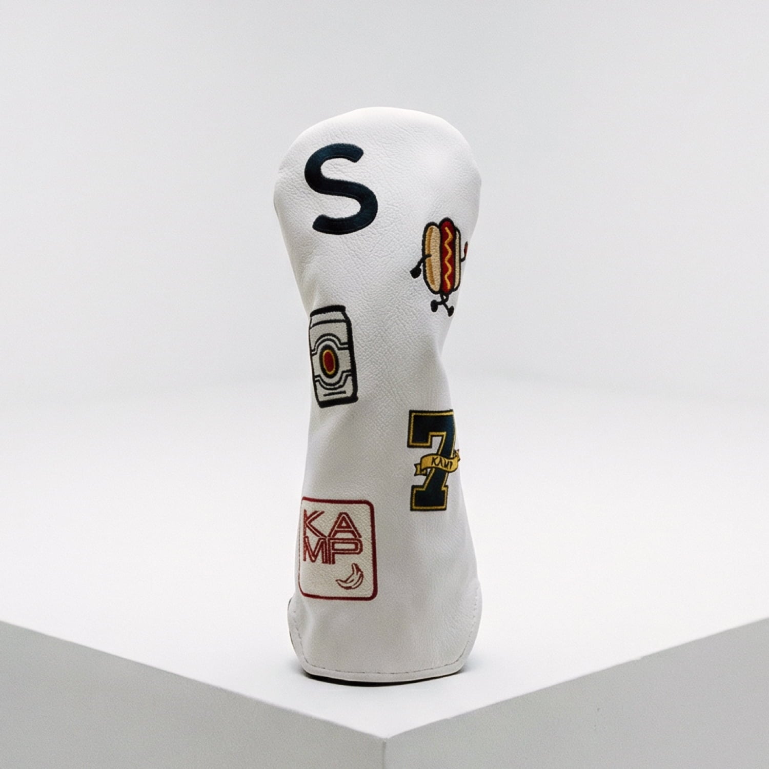 Custom white hybrid golf cover with S monogram, hot dog, beer can, number 7, and KAMP banana logo - handmade vegan leather