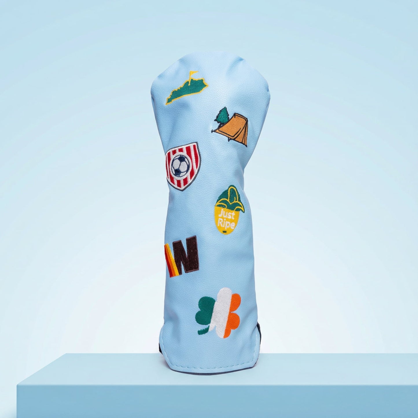Custom light blue fairway wood head cover with Kentucky state, Irish shamrock, soccer crest, and camping tent patches - personalized golf cover
