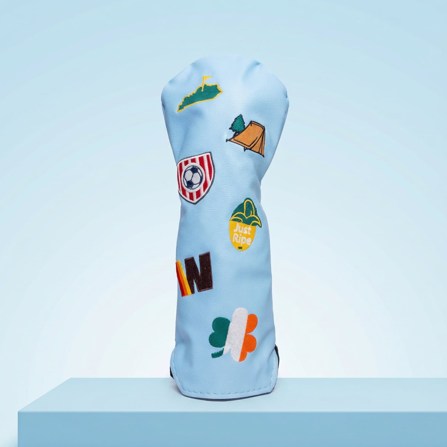 Custom light blue fairway wood head cover with Kentucky state, Irish shamrock, soccer crest, and camping tent patches - personalized golf cover