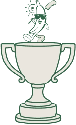 Golf trophy cup with golf ball dropping in